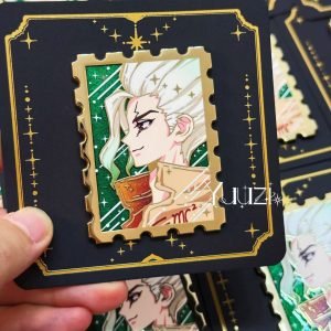 Dcst Stamp 1.0 Enamel Pin in hand